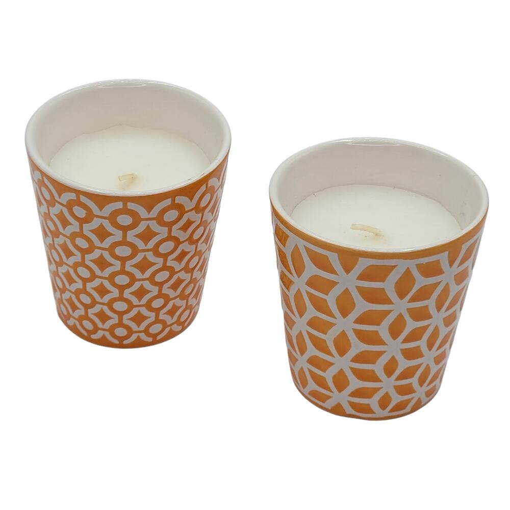 Geometric Harmony: Pair of Scented Candles in Orange and White Holders